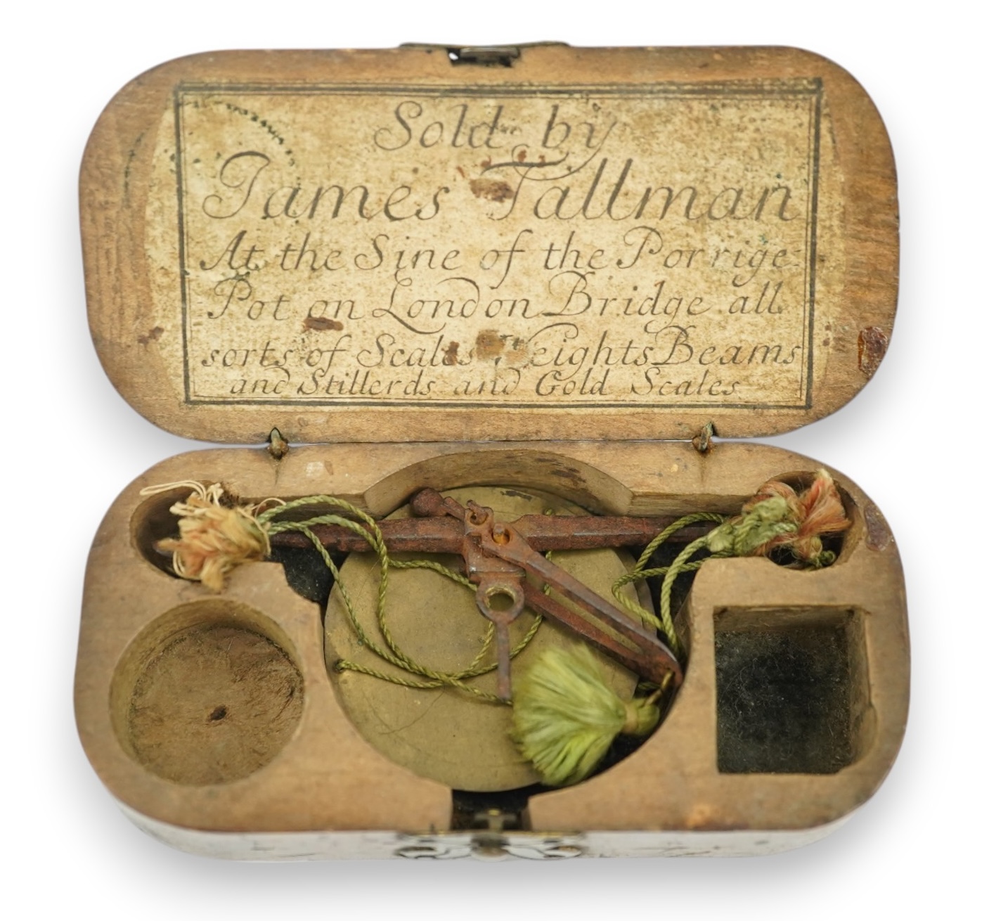 A cased set of late 17th century gold scales labelled for 'James Tallman, At the Sign of the Porridge Pot, on London Bridge, London, all sorts of Scales Weights Beams and Stillerds [sic] and Gold Scales', in original woo